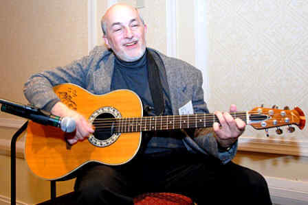 Dr. Pantaleno playing a guitar